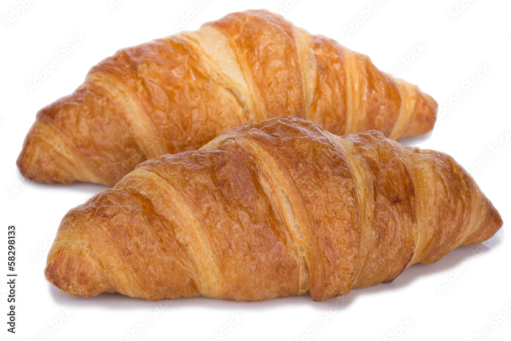 fresh and tasty croissant over white background