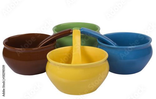 Close-up of ceramic bowls and soup spoons