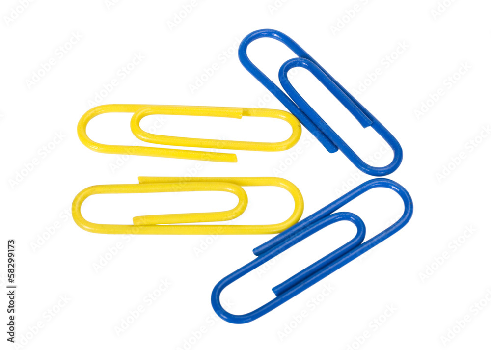 Close-up of paper clips arranged in arrow shape Close-up of paper clips arranged in arrow shape