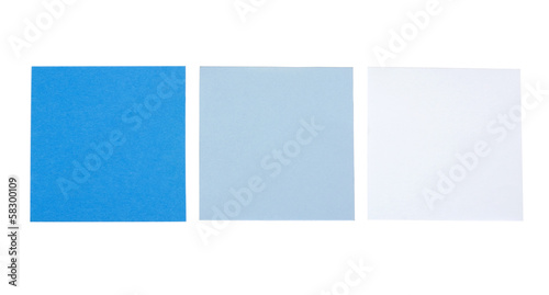 Close-up of three blank adhesive notes
