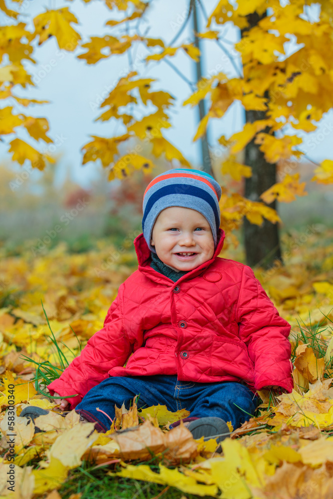 Baby boy in the autumn park