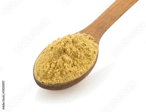 mustard spices in spoon on white