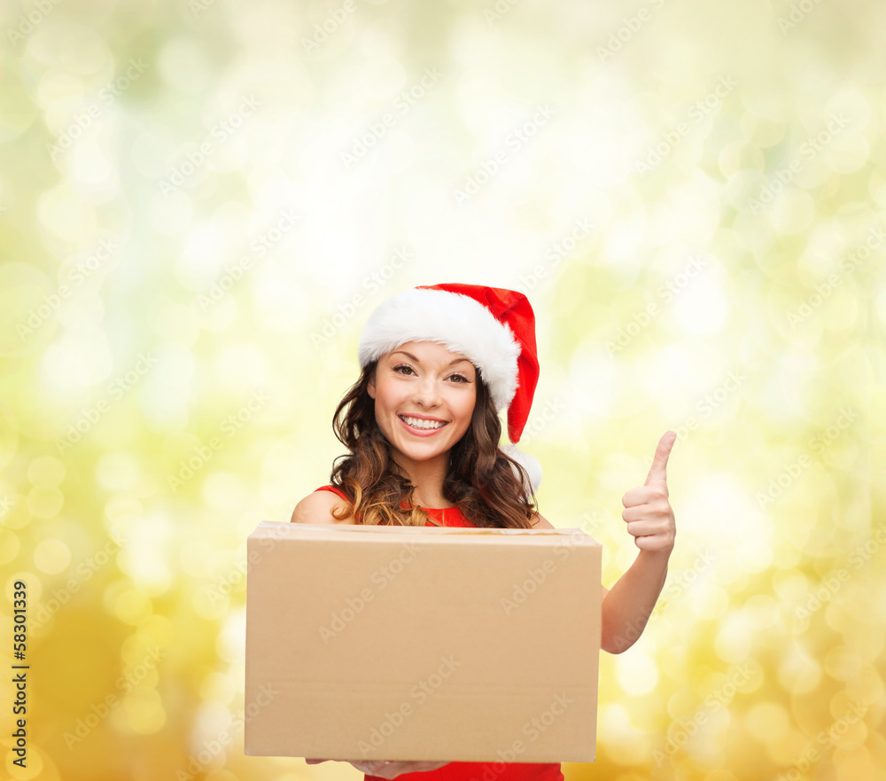 smiling woman in santa helper hat with parcel box smiling woman in santa helper hat with parcel box