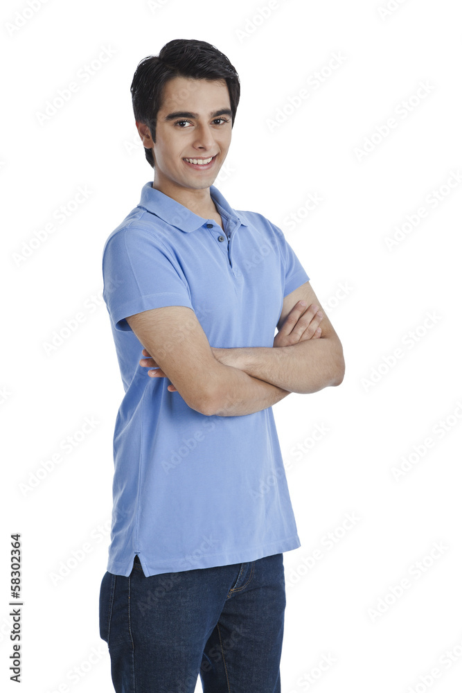 Man standing with his arms crossed and smiling Man standing with his arms crossed and smiling