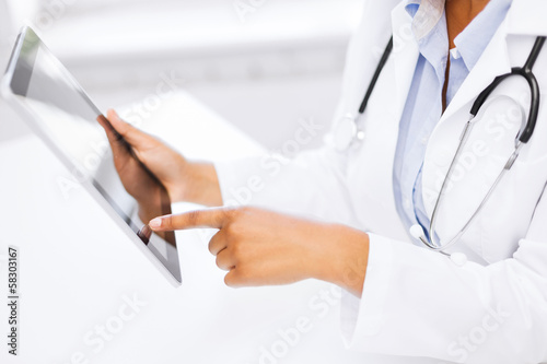 female doctor working with tablet pc