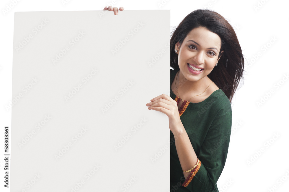 Portrait of a happy woman holding a whiteboard Portrait of a happy woman holding a whiteboard