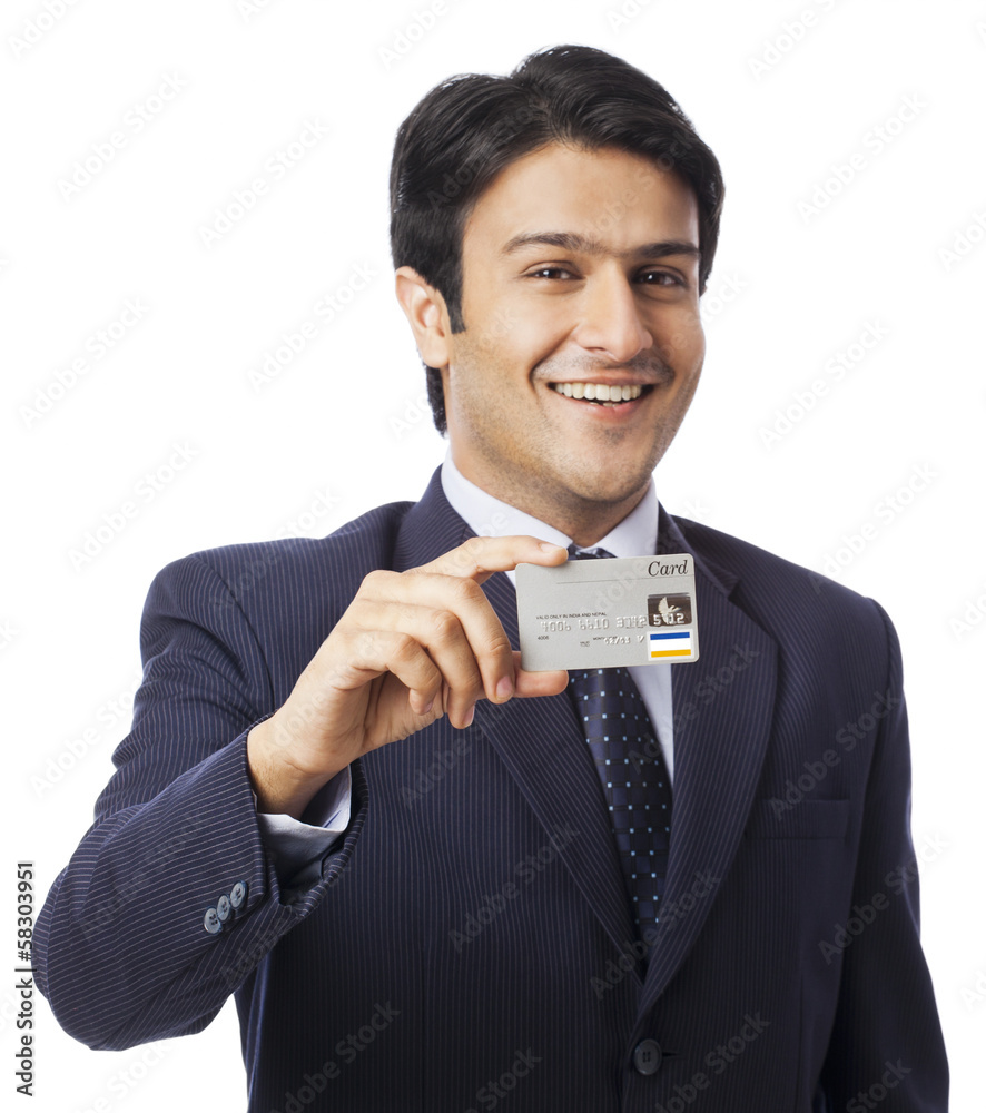 Portrait of a businessman showing a credit card Portrait of a businessman showing a credit card