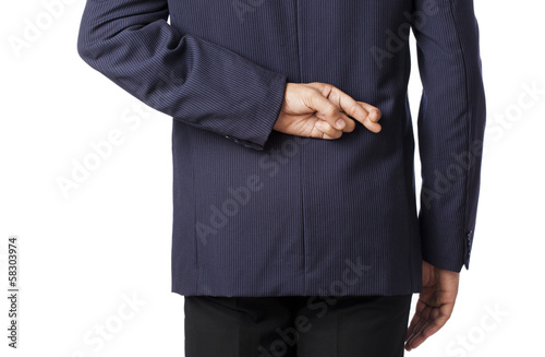 Rear view of a businessman with fingers crossed