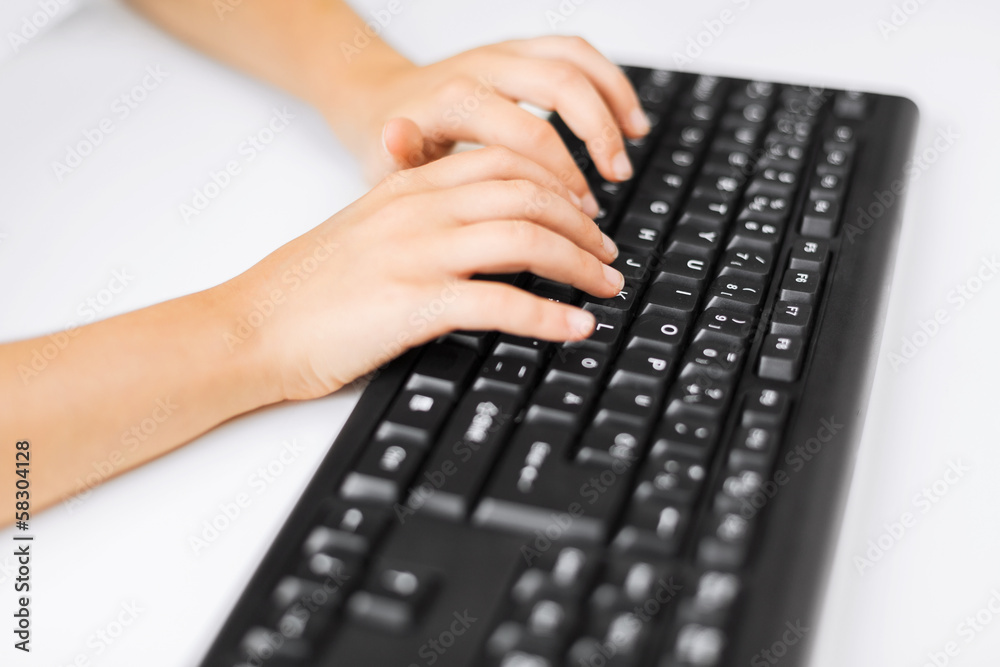 student girls hands typing on keyboard student girls hands typing on keyboard