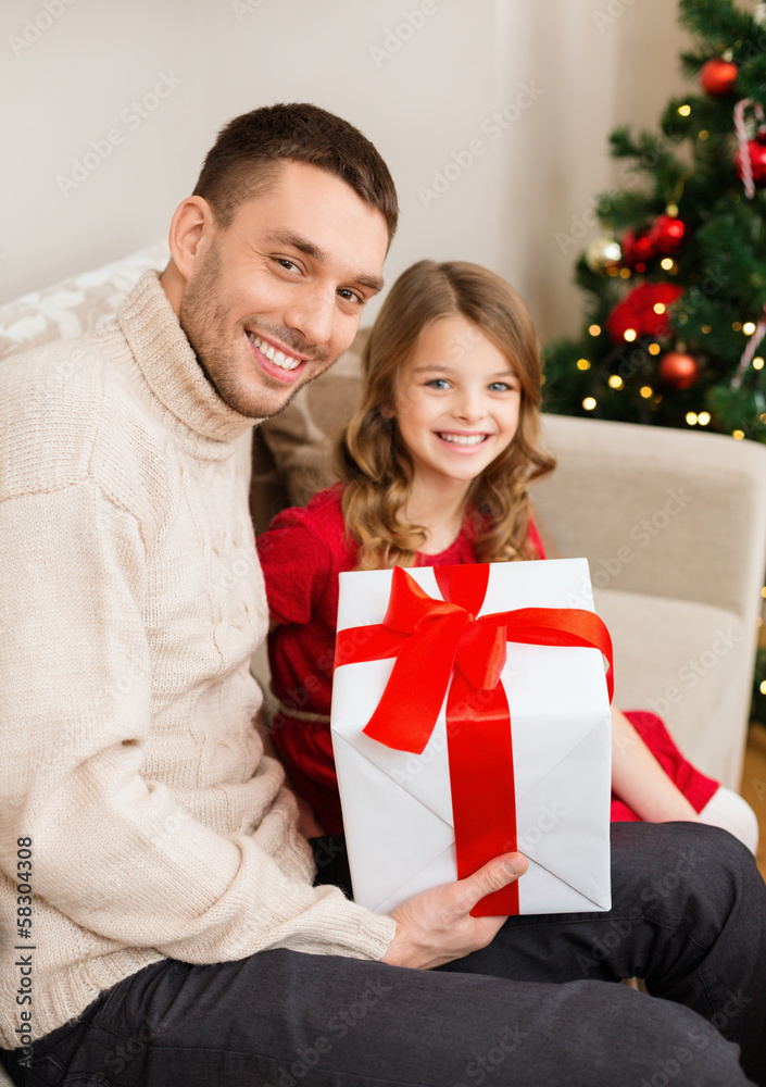 smiling father and daughter holding gift box smiling father and daughter holding gift box
