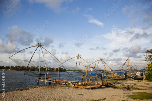 Chinese fishing nets and boats on the beach, Cochin, Kerala, India © imagedb.com