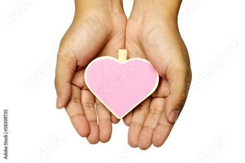 Human Hand Holding Heart Shape Wooden Sign