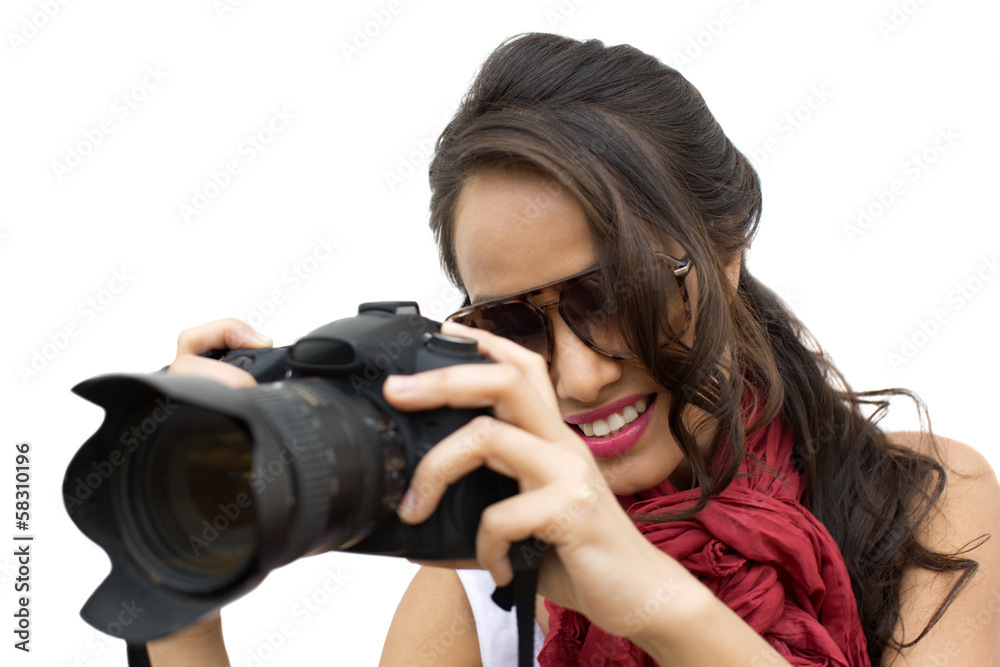 Female photographer taking a picture with camera Female photographer taking a picture with camera