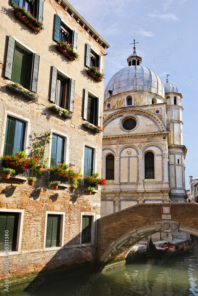 Bridge over a canal with a church in the background, Venice, Veneto, Italy