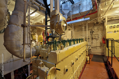 The diesel engine in the hold of the old ship