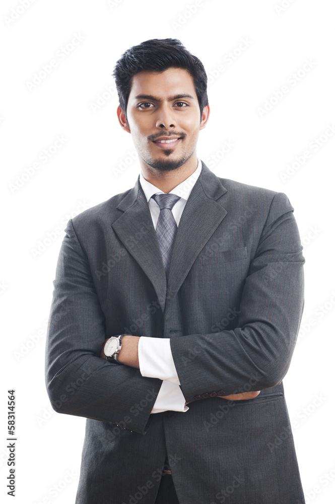 Portrait of a businessman standing with his arms crossed Portrait of a businessman standing with his arms crossed