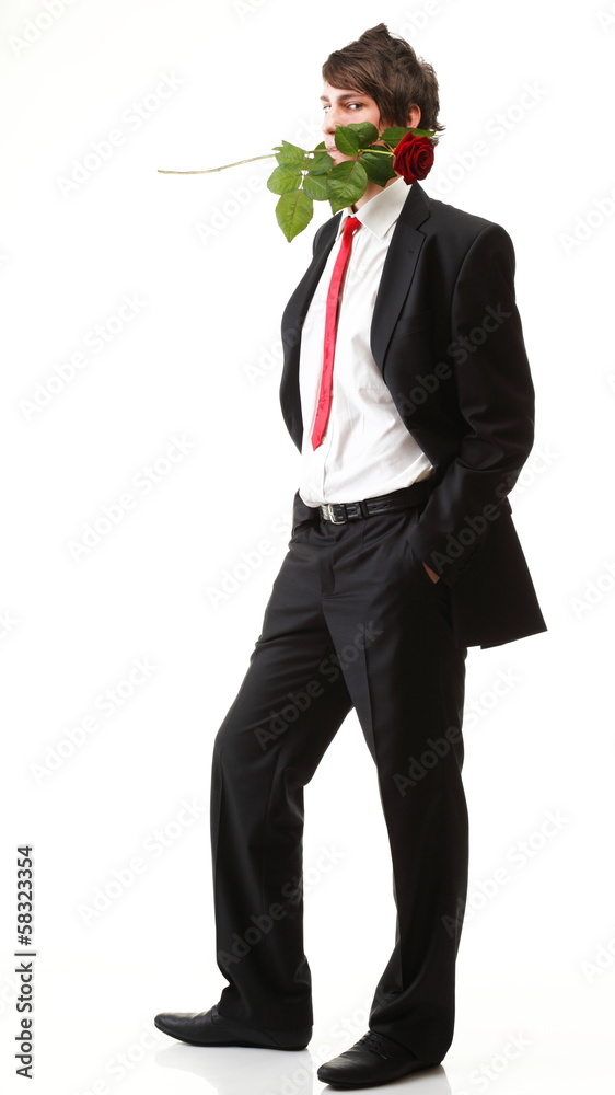 Elegant teenager with rose in his teeth isolated Elegant teenager with rose in his teeth isolated