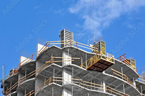 Wallpaper Mural Crane and building construction site against blue sky Torontodigital.ca