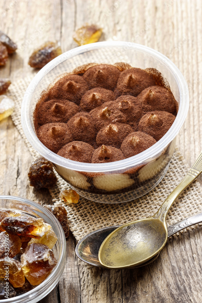 Tiramisu dessert on wooden table. Italian confectionery Tiramisu dessert on wooden table. Italian confectionery