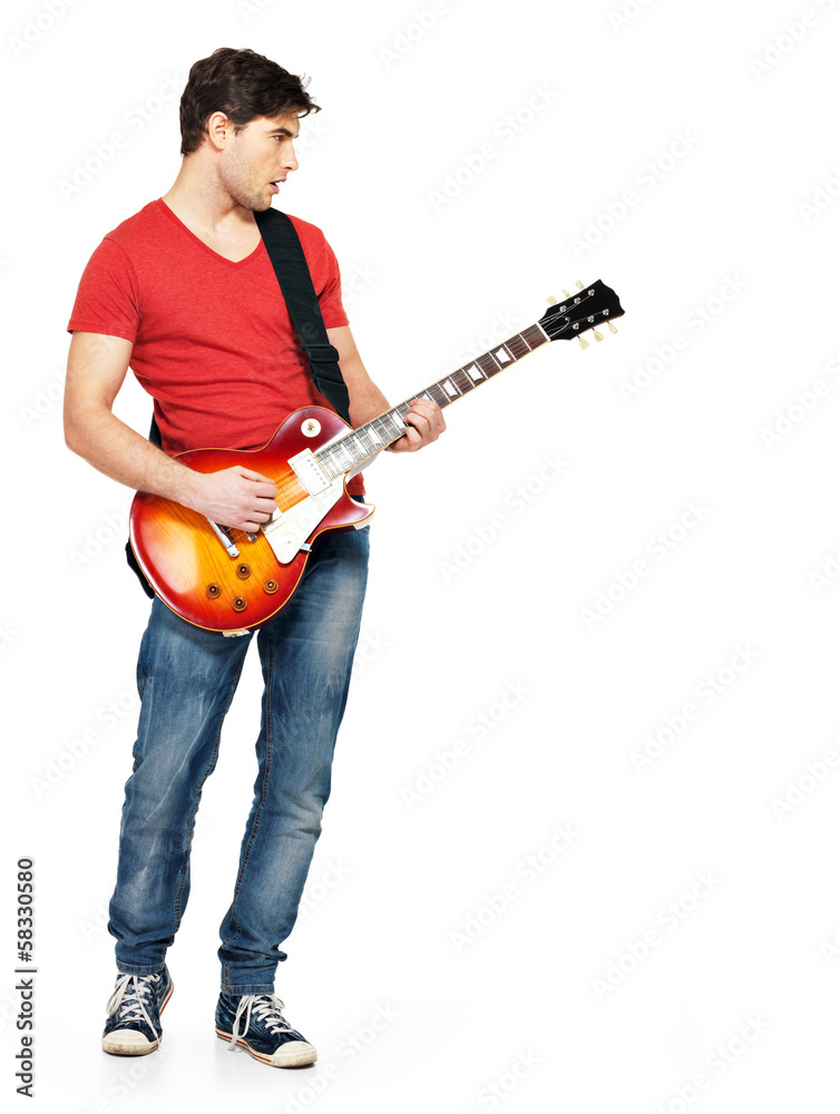 Young guitarist plays on the electric guitar Young guitarist plays on the electric guitar
