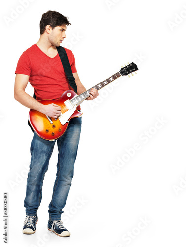 Young guitarist plays on the electric guitar Fototapet