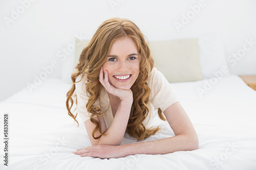 Portrait of a pretty young woman in bed