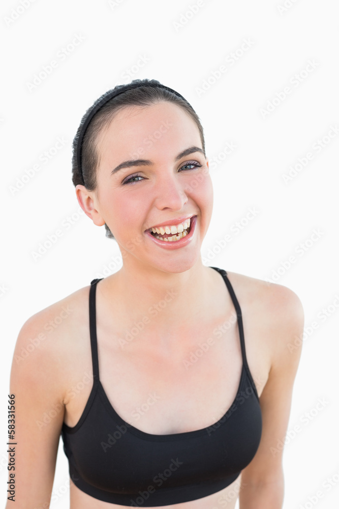Close up portrait of a sporty young woman smiling