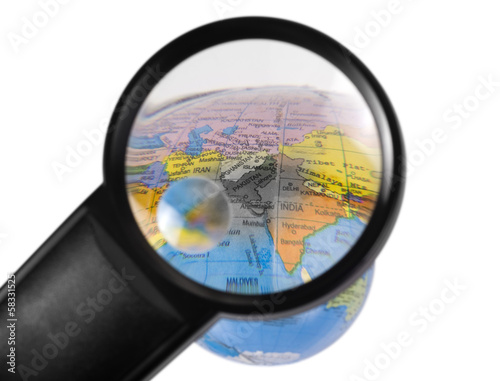 Photography India on globe viewed through a magnifying glass