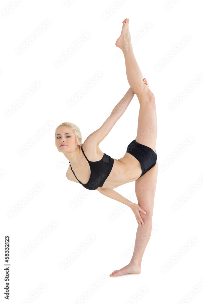 Full length of a sporty young woman stretching body Full length of a sporty young woman stretching body