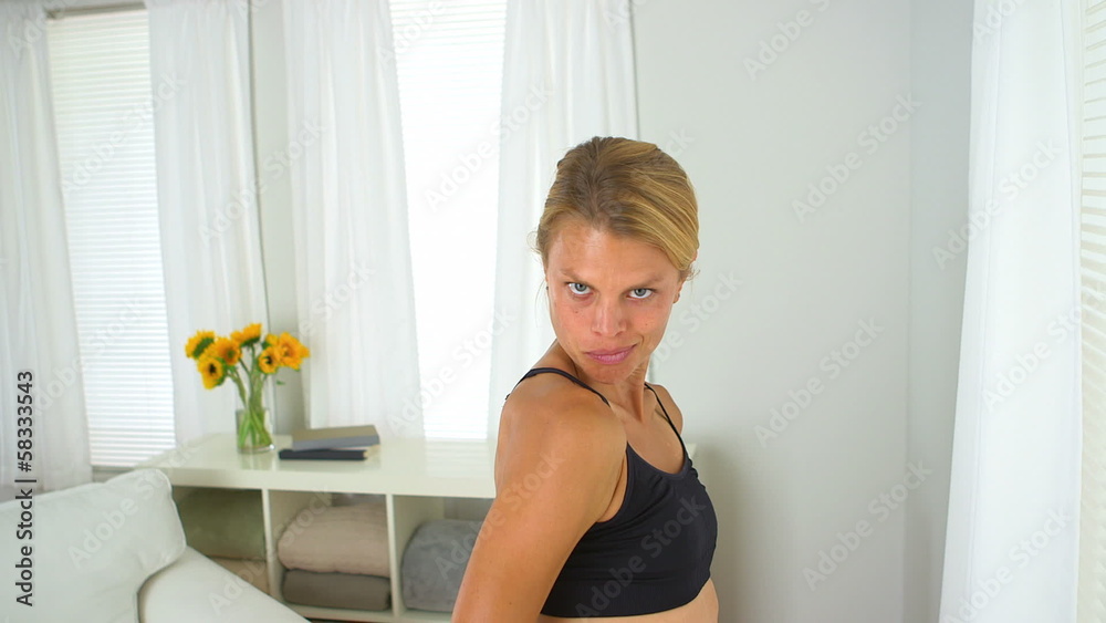 Blonde woman showing off her muscles Blonde woman showing off her muscles