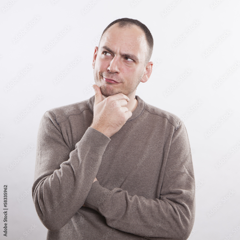 Portrait of a thoughtful man isolated over white background Portrait of a thoughtful man isolated over white background