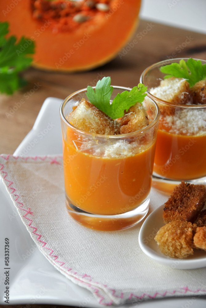 two glasses with pumpkin soup and bread two glasses with pumpkin soup and bread