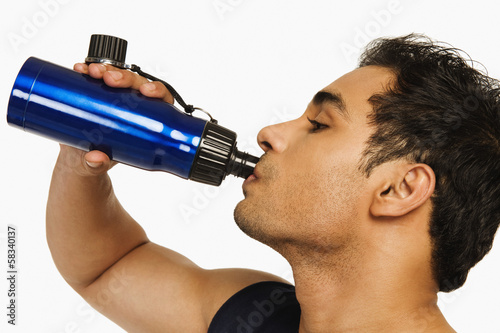 Man drinking water from a bottle