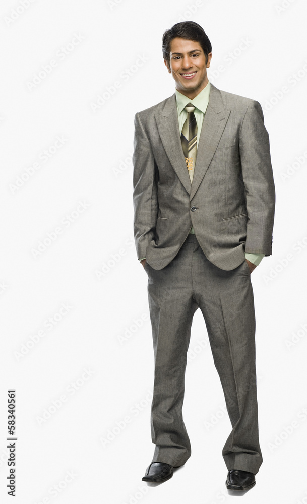 Portrait of a man with hands in pockets