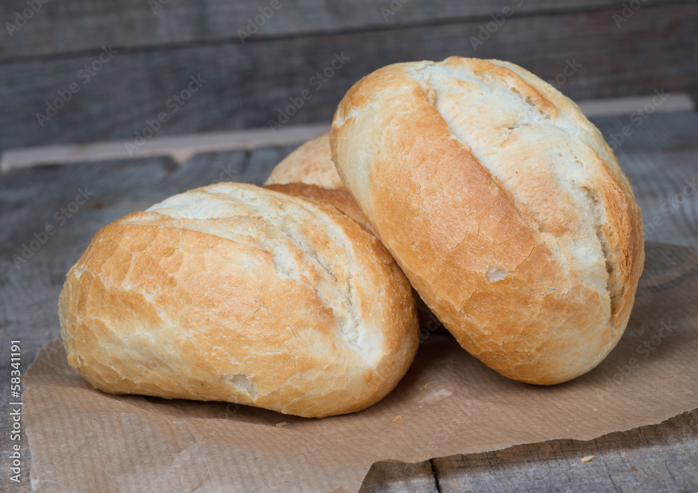 Wheat bread roll on a cutting board