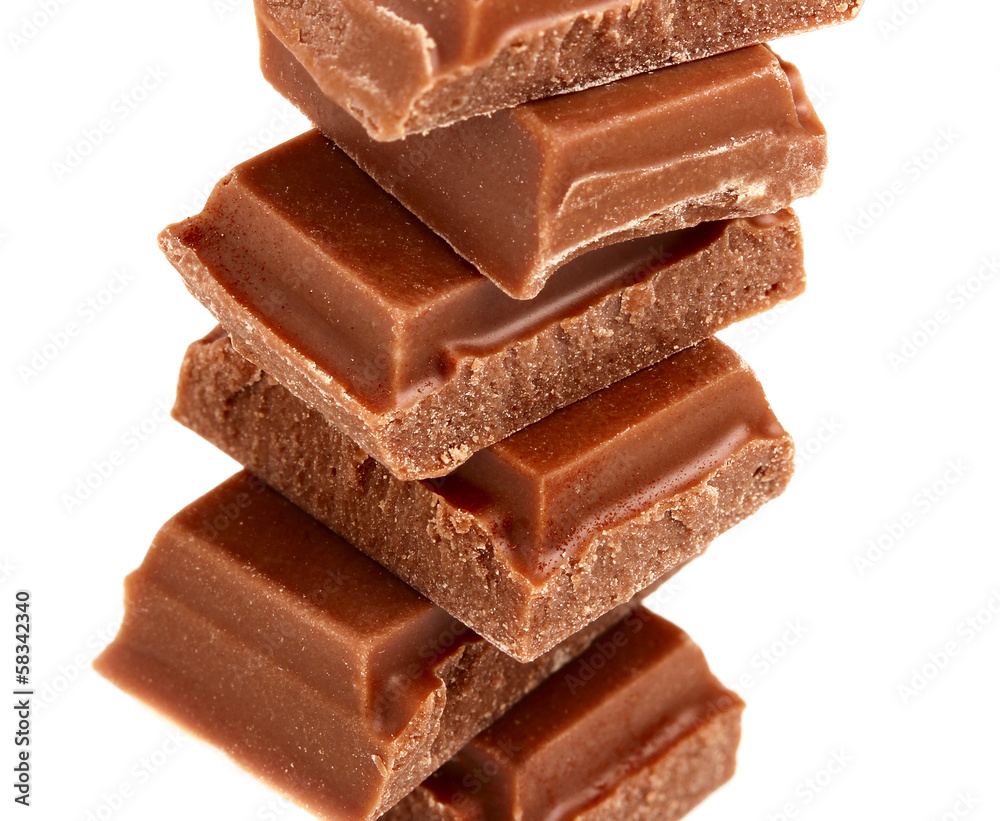 Pieces of milk chocolate closeup.