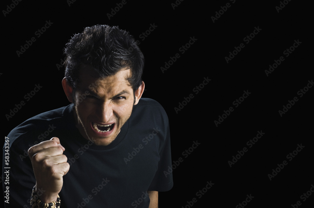 Portrait of a man looking angry Portrait of a man looking angry