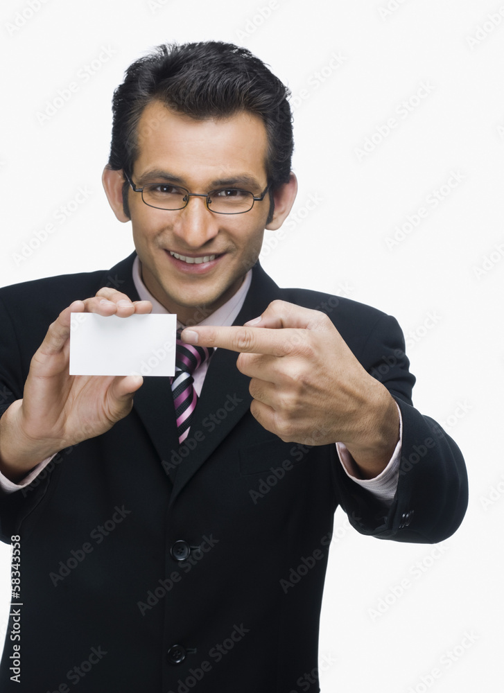 Portrait of a businessman showing a business card Portrait of a businessman showing a business card