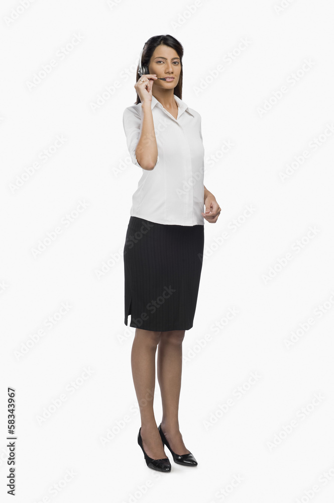Female customer service representative using a headset Female customer service representative using a headset