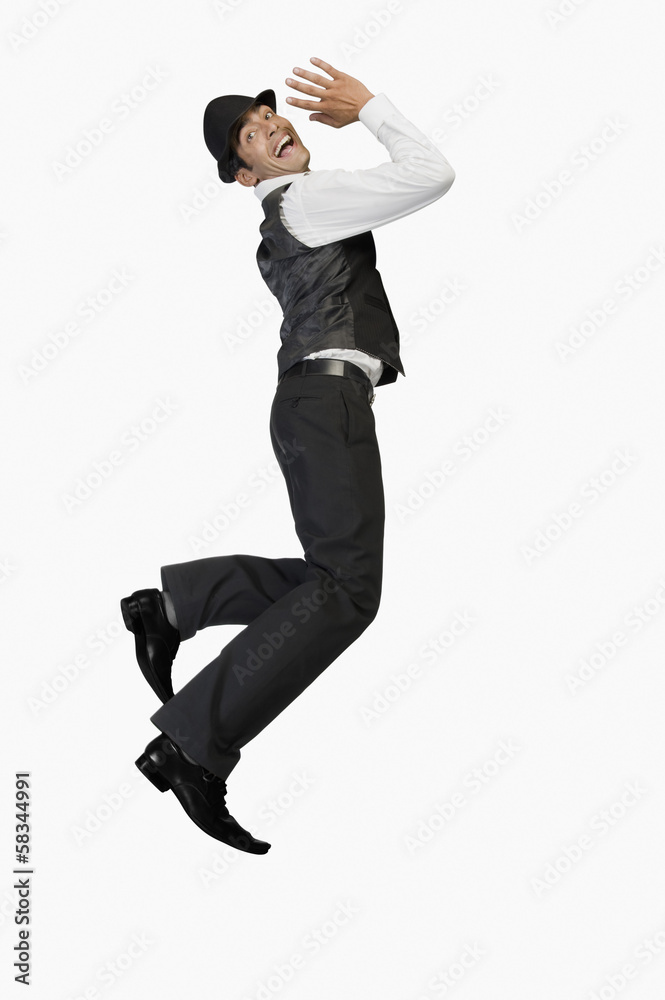 Portrait of a businessman jumping and smiling Portrait of a businessman jumping and smiling