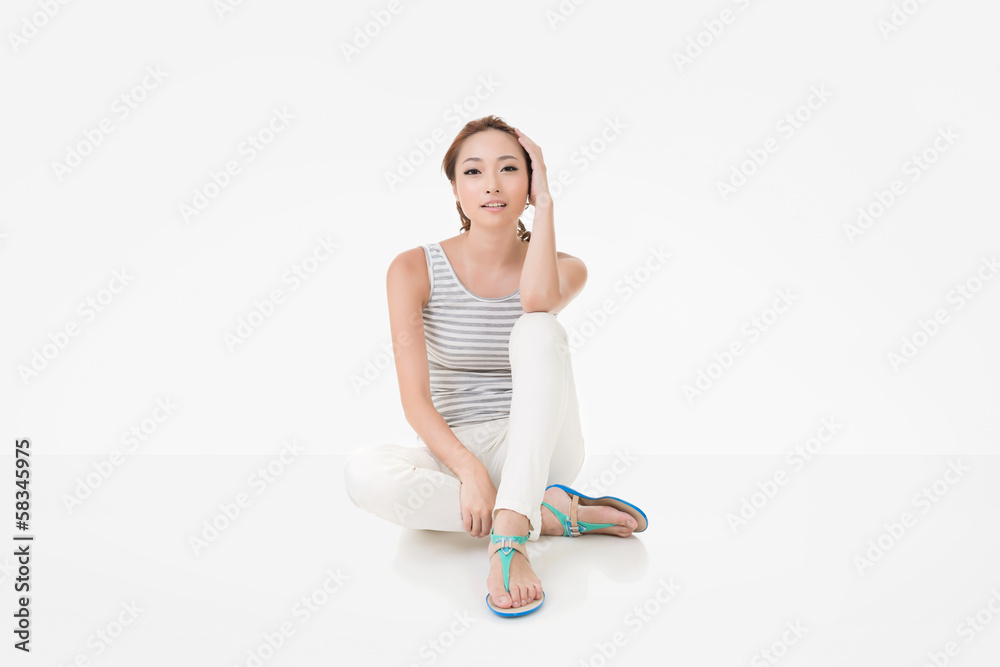 Attractive asian woman sit on ground Attractive asian woman sit on ground