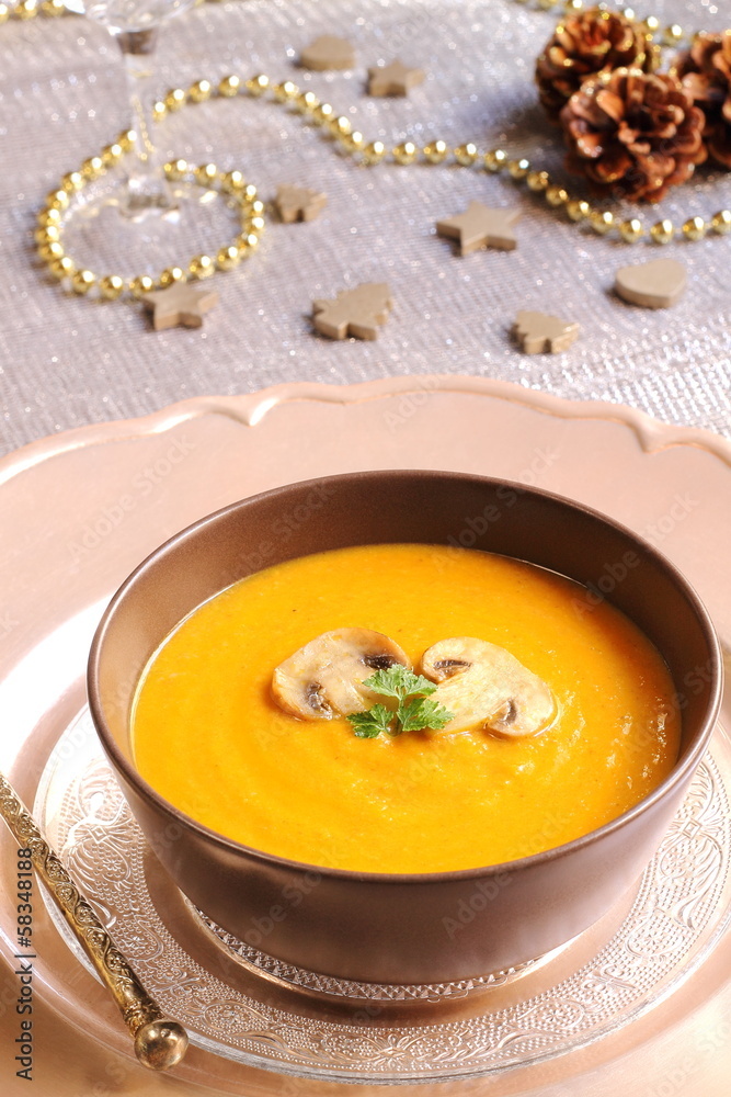 Pumpkin and mushroom soup on a festive table Pumpkin and mushroom soup on a festive table