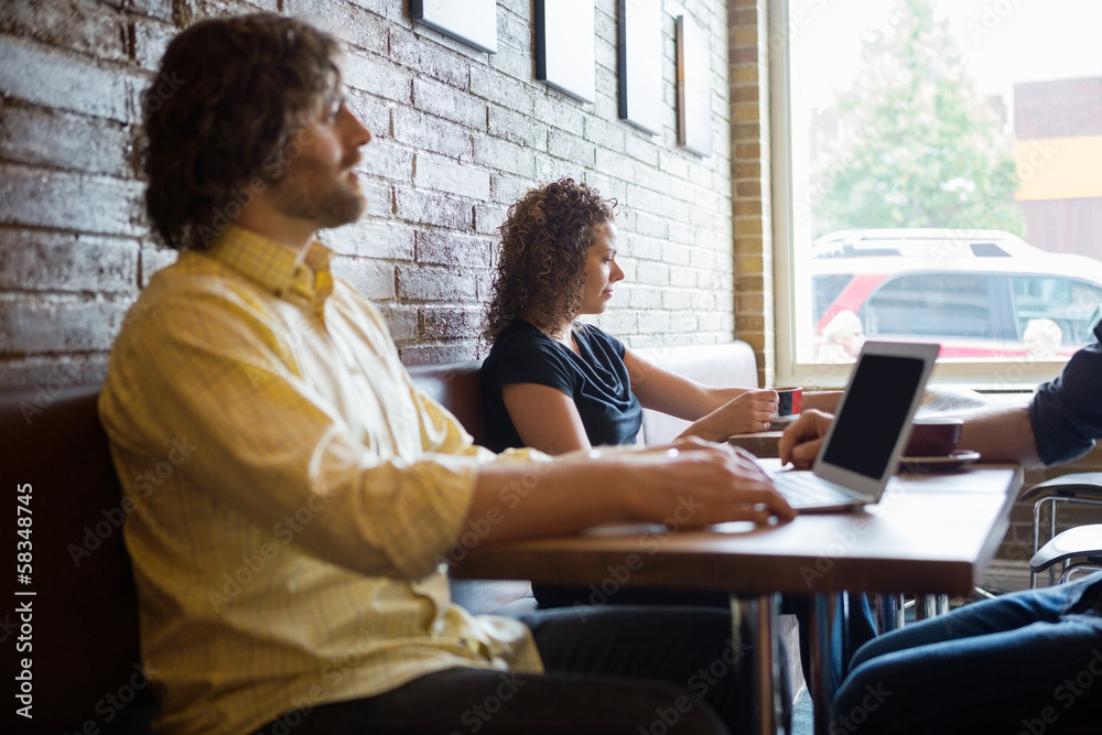 Customers Spending Leisure Time In Coffeeshop Customers Spending Leisure Time In Coffeeshop