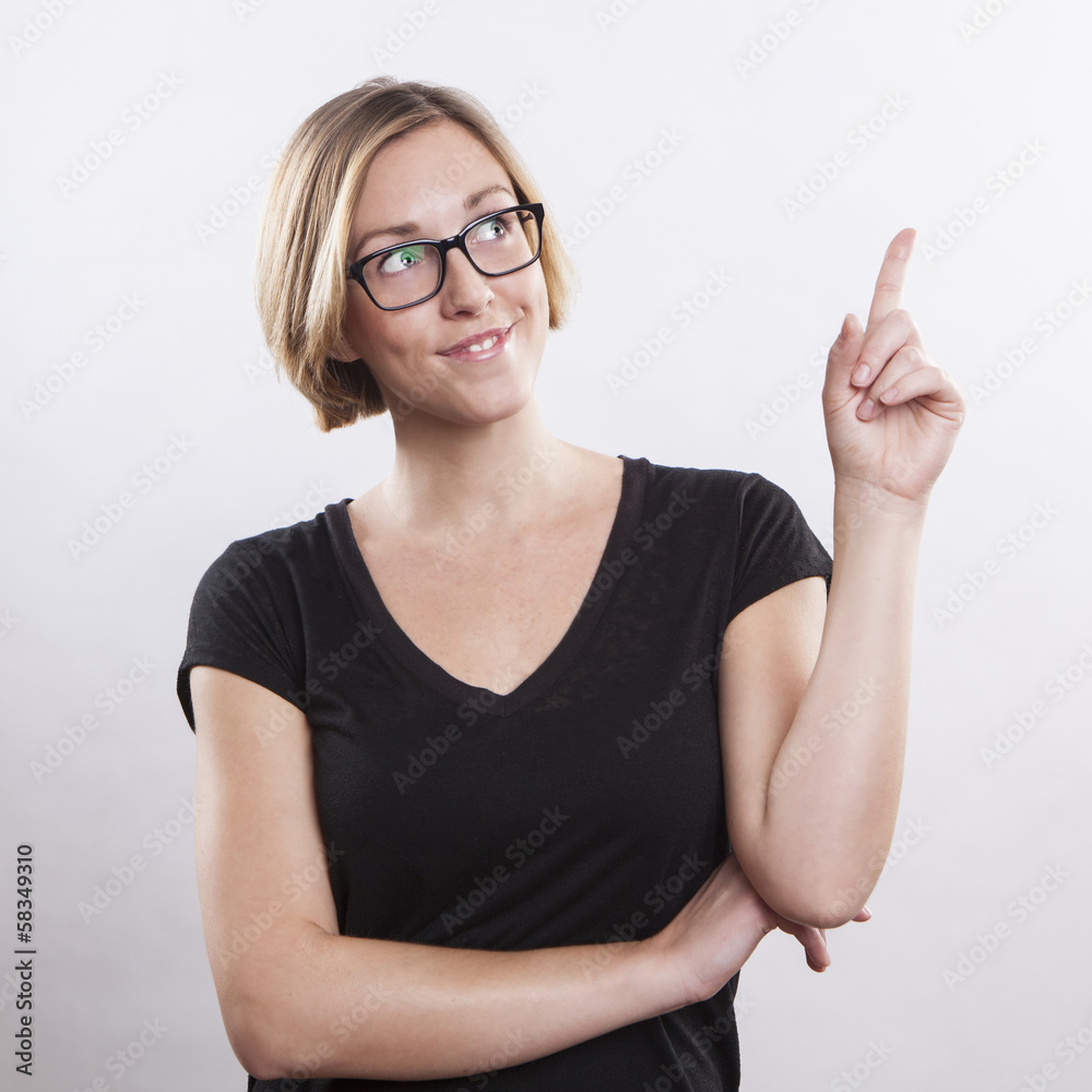 young woman pointing up, showing something, having an idea young woman pointing up, showing something, having an idea