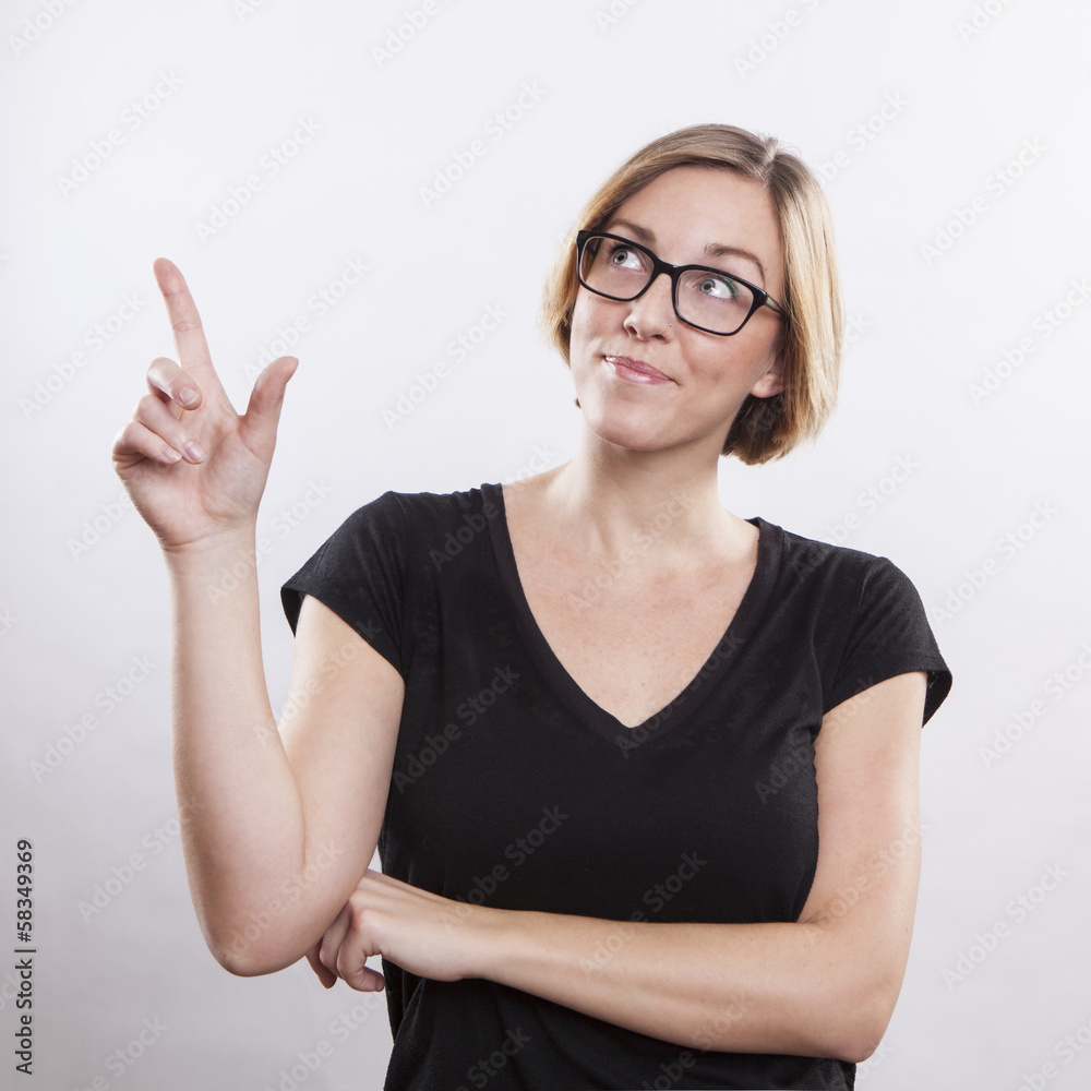young woman pointing up, showing something, having an idea young woman pointing up, showing something, having an idea