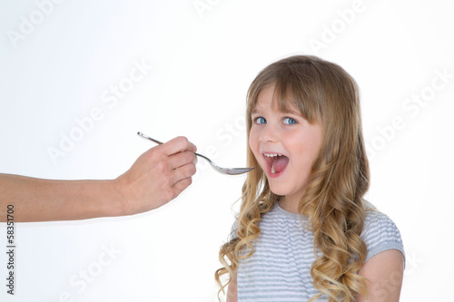 child takes medicine