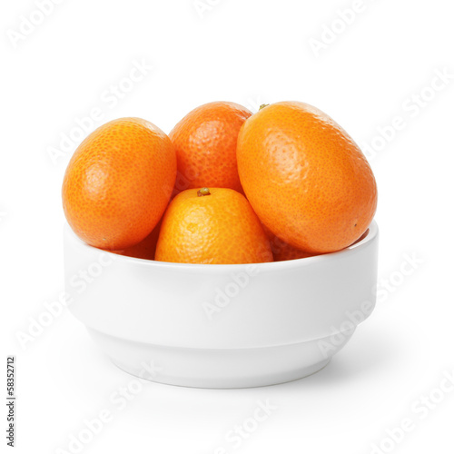 ripe kumquat fruits in bowl