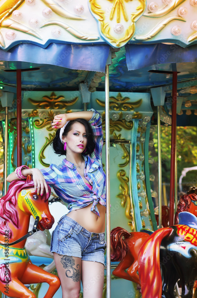 Amusement Park. Attractive Woman in Fanfair on Arcade