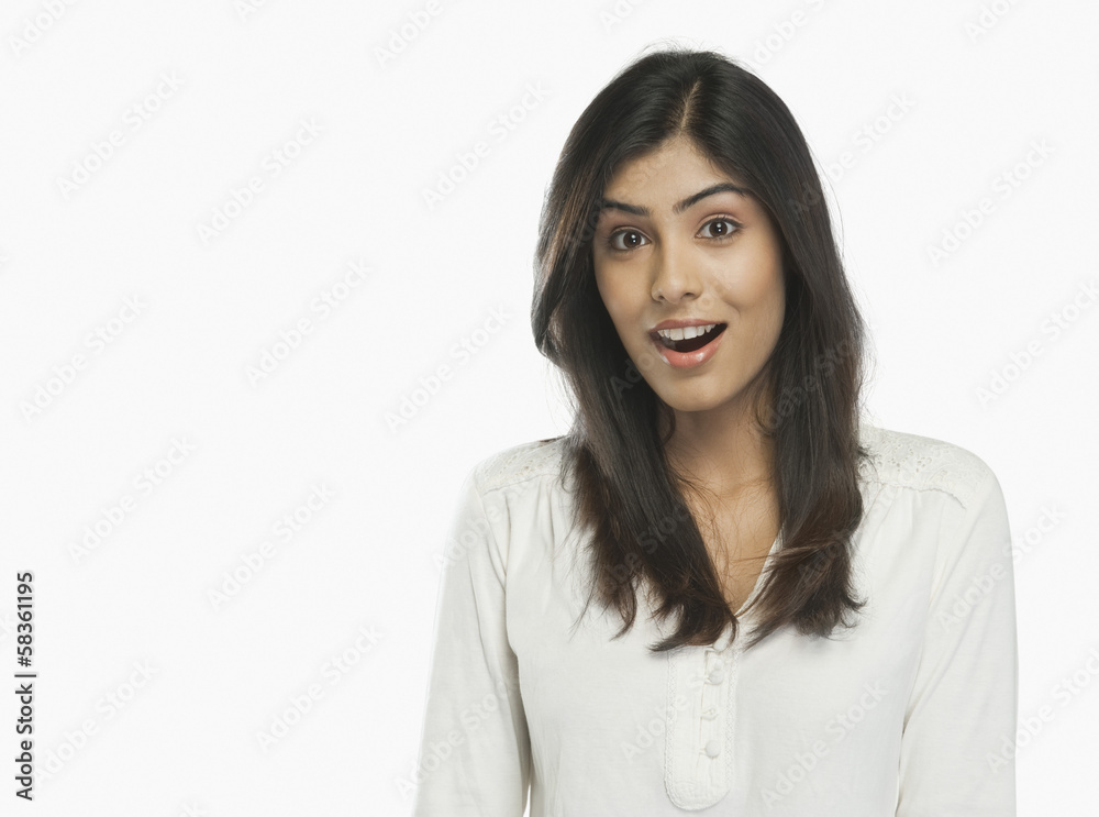 Portrait of a woman looking surprised Portrait of a woman looking surprised