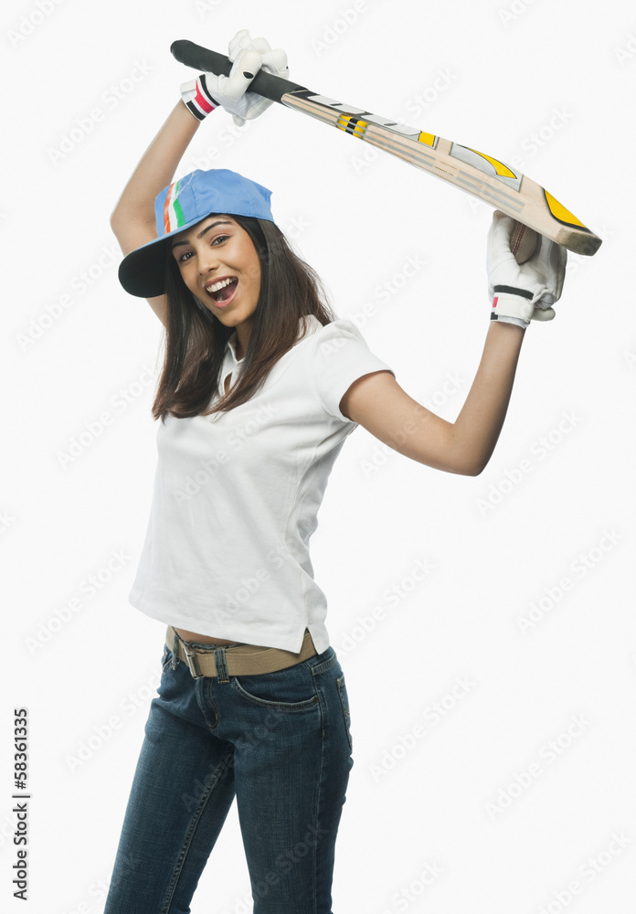 Portrait of a female cricket fan cheering Portrait of a female cricket fan cheering